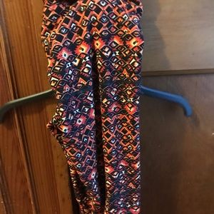 Never worn lularoe leggings. Yellows oranges black